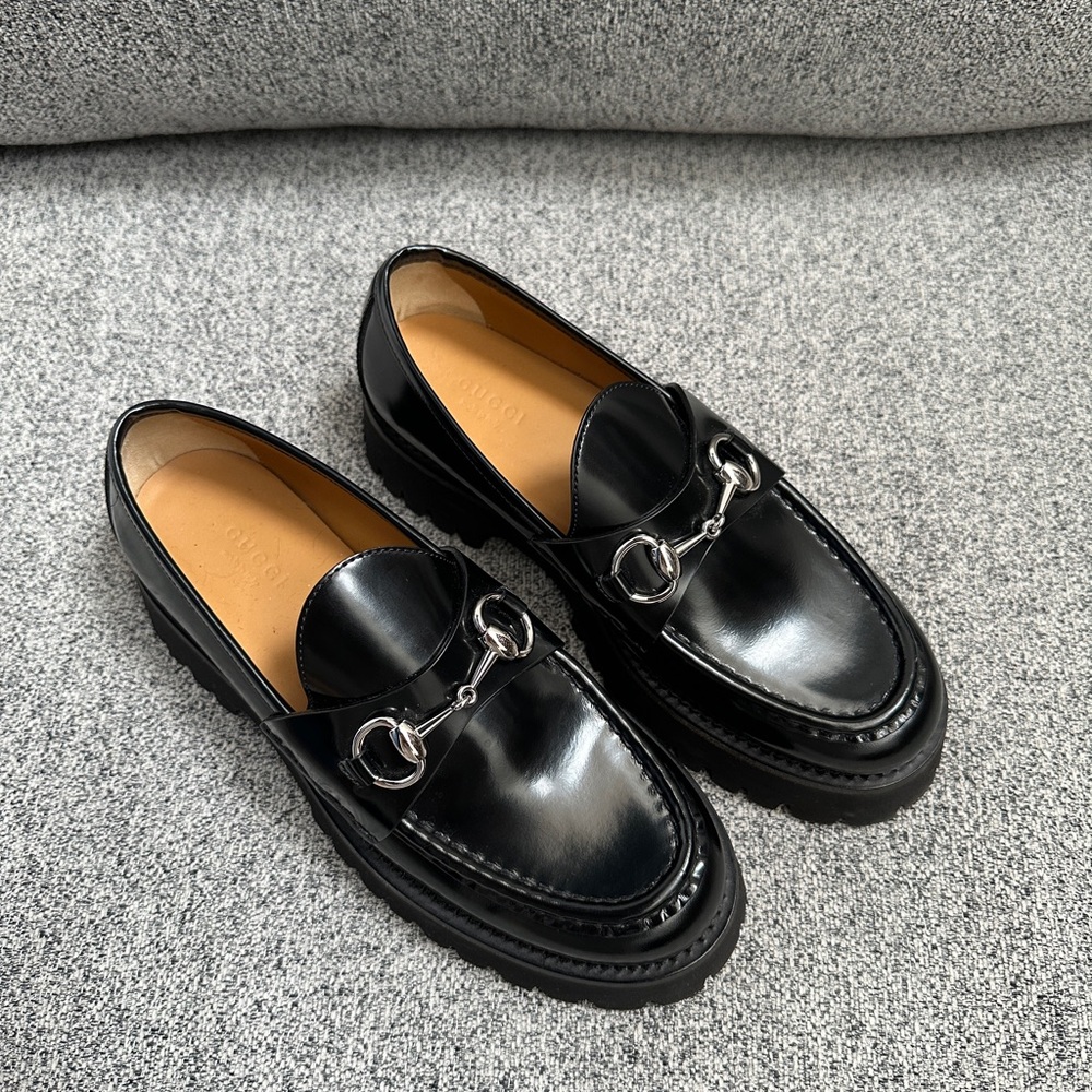 Gucci black leather lug sole horsebit loafers